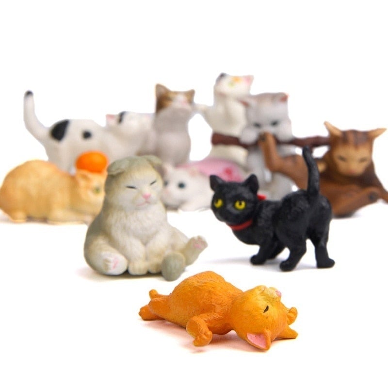 Cats in various poses figurines